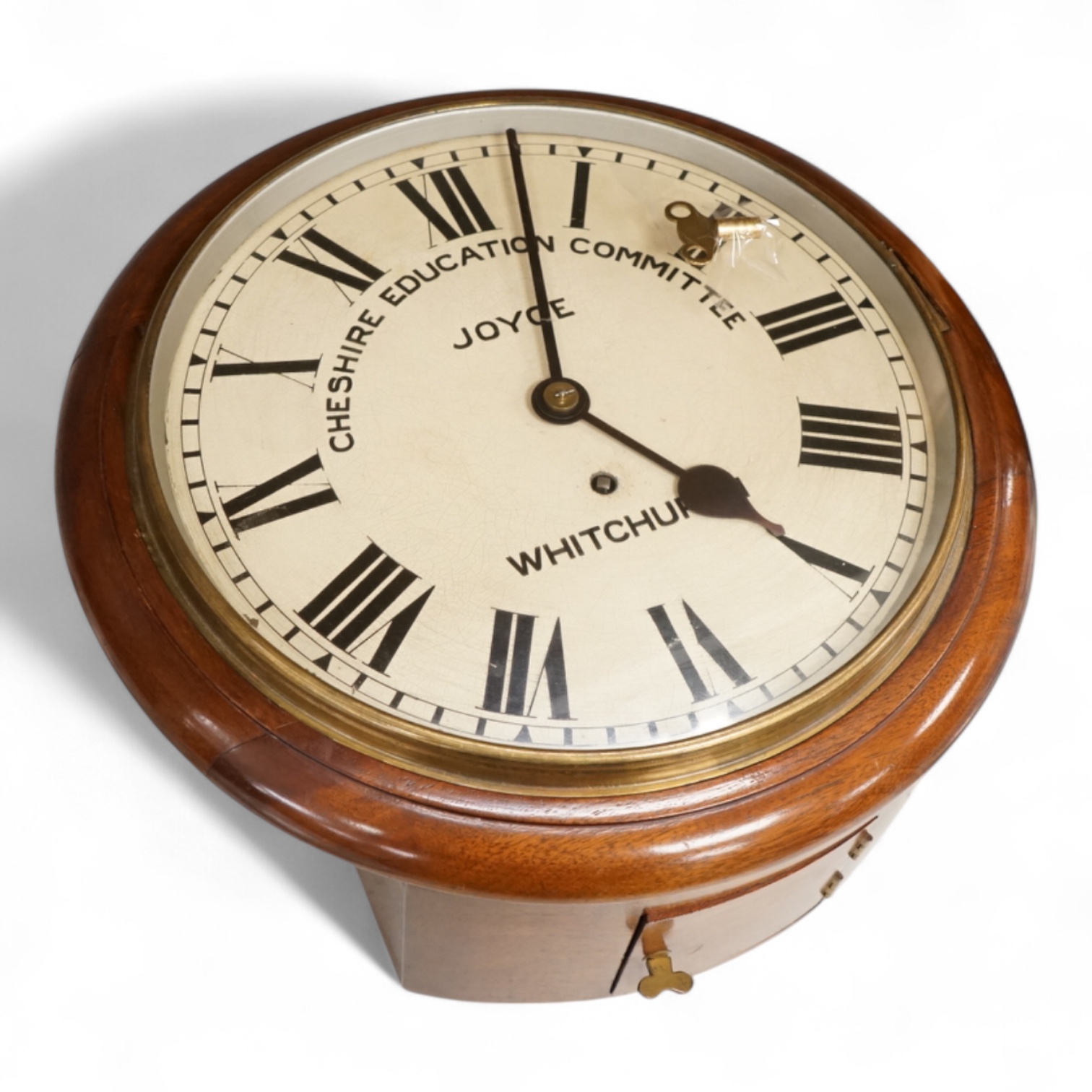 A Cheshire Education Committee wall clock by Joyce of Whitchurch, with key and pendulum, 39cm in diameter